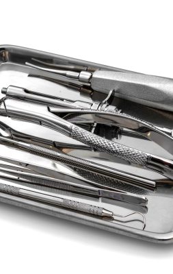 Dental tools and equipment on white background.