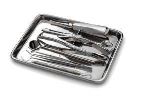 Dental tools and equipment on white background.