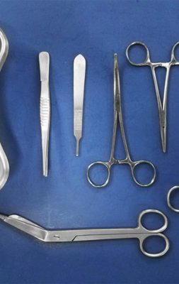 Dental tools and equipment on white background.