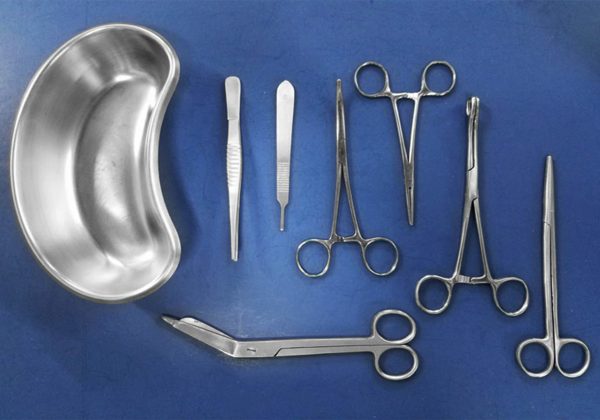 Dental tools and equipment on white background.